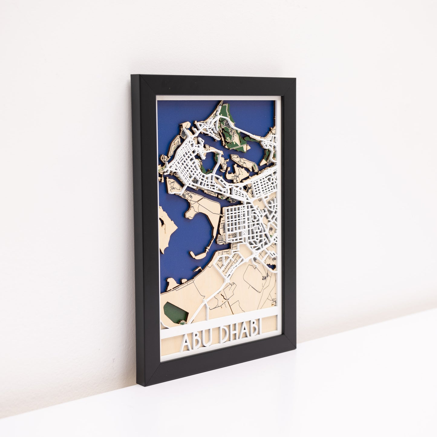 Detailed 3D wooden Abu Dhabi map – layered design for modern interior wall décor